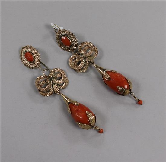 A large pair of yellow metal and facetted coral drop earrings, 12.5cm.